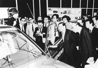 Martine Kempf in Japan 1984 showing voice conrolled car